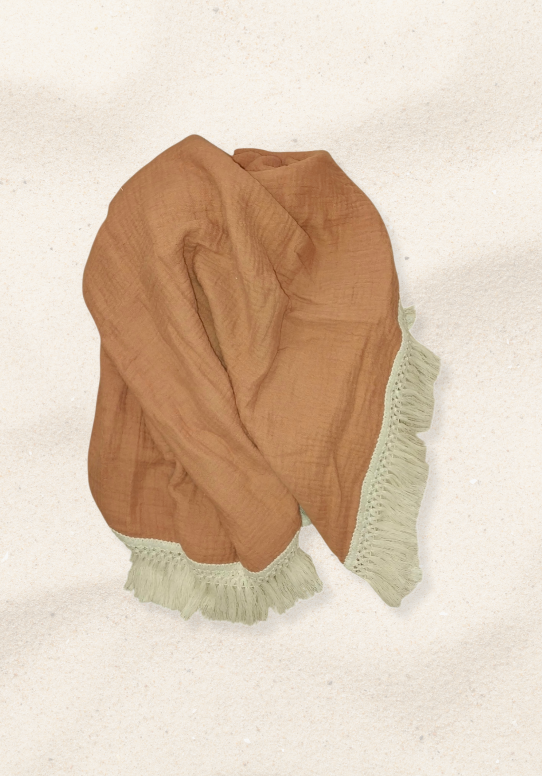 Solid terracotta baby blanket made of soft cotton bamboo fabric with vintage cream fringe detailing.