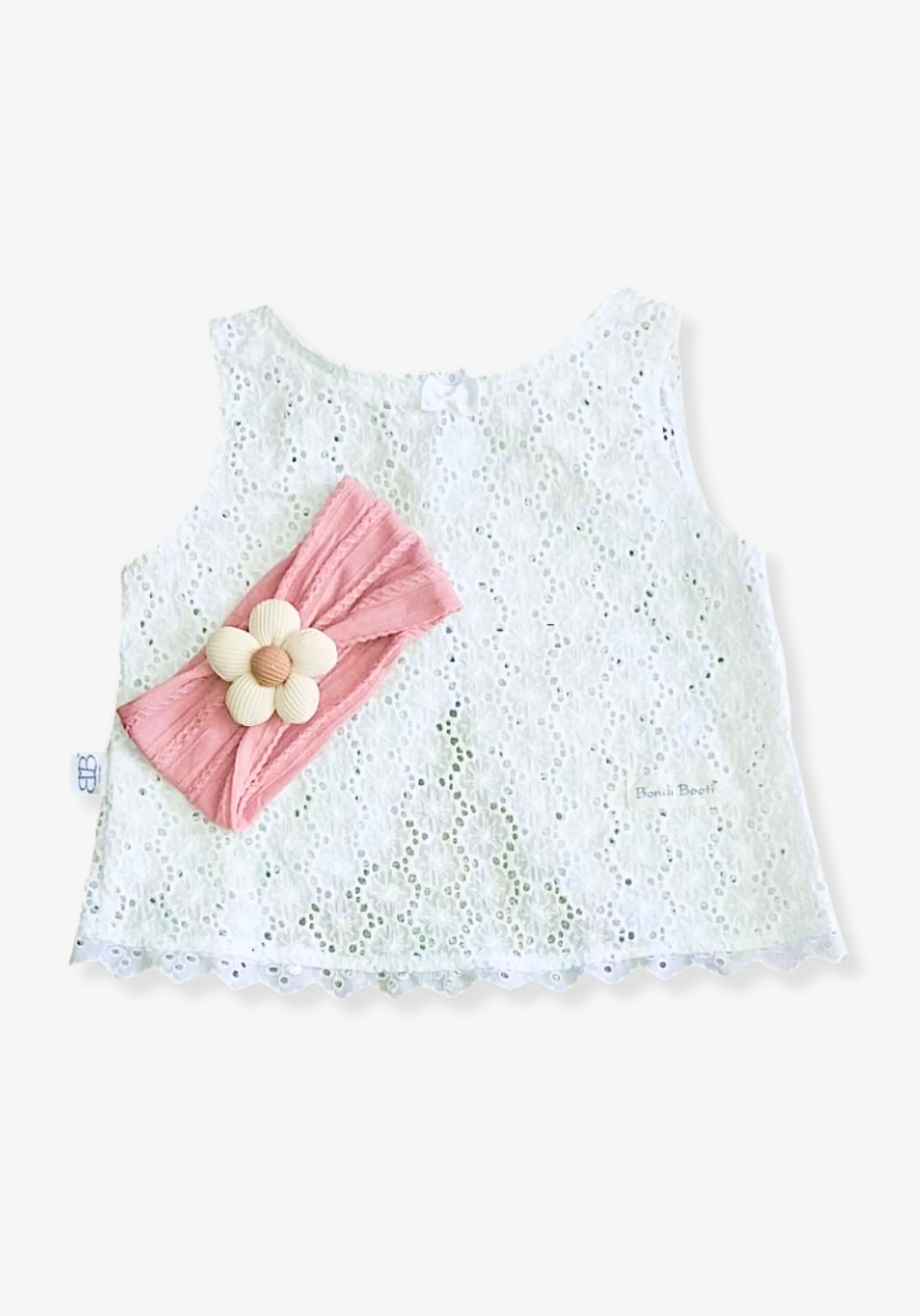 Blush pink toddler head band featuring a soft cream daisy flower at the front.