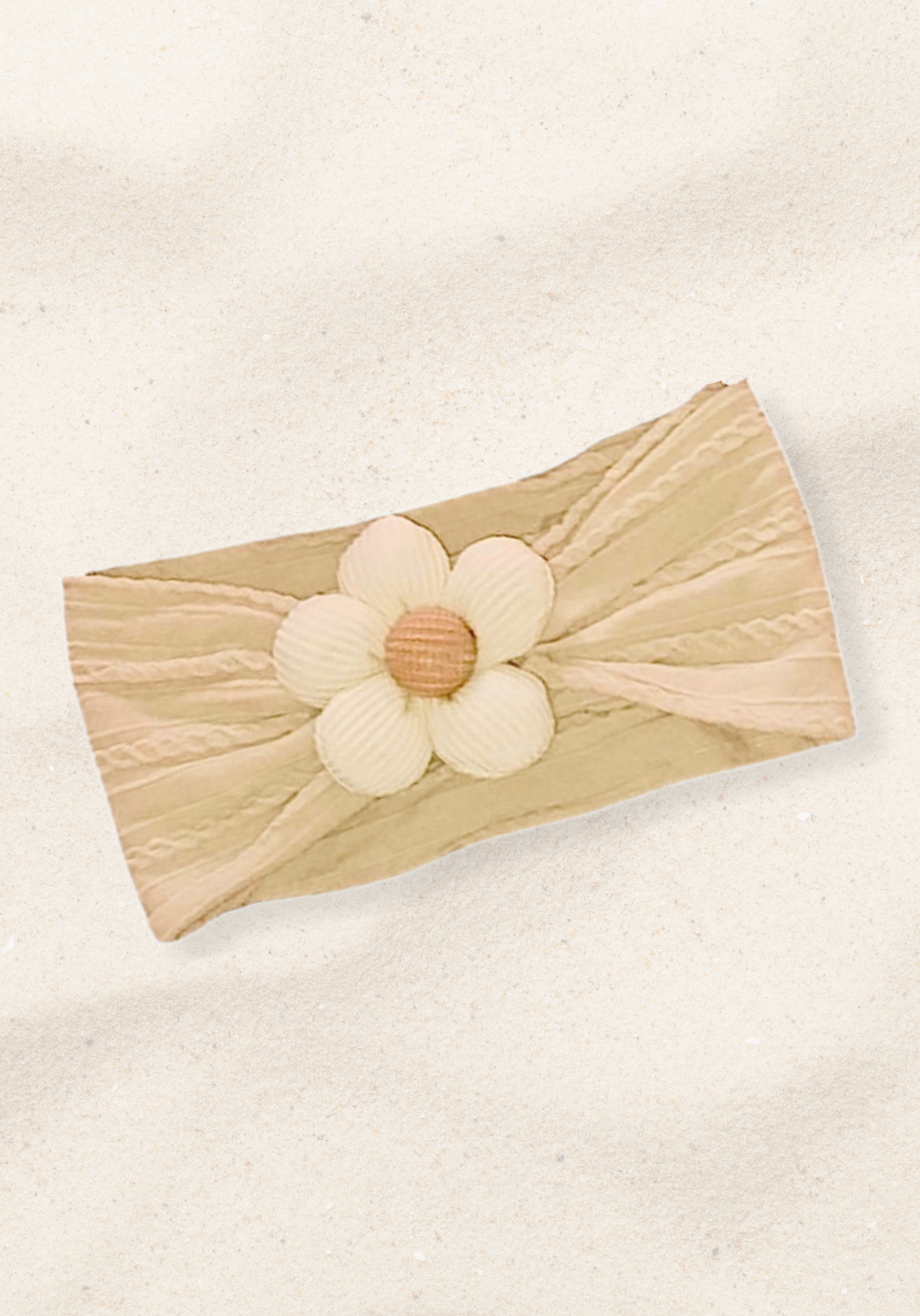 Oat-colored toddler head band with a cream daisy flower sewn at the center.