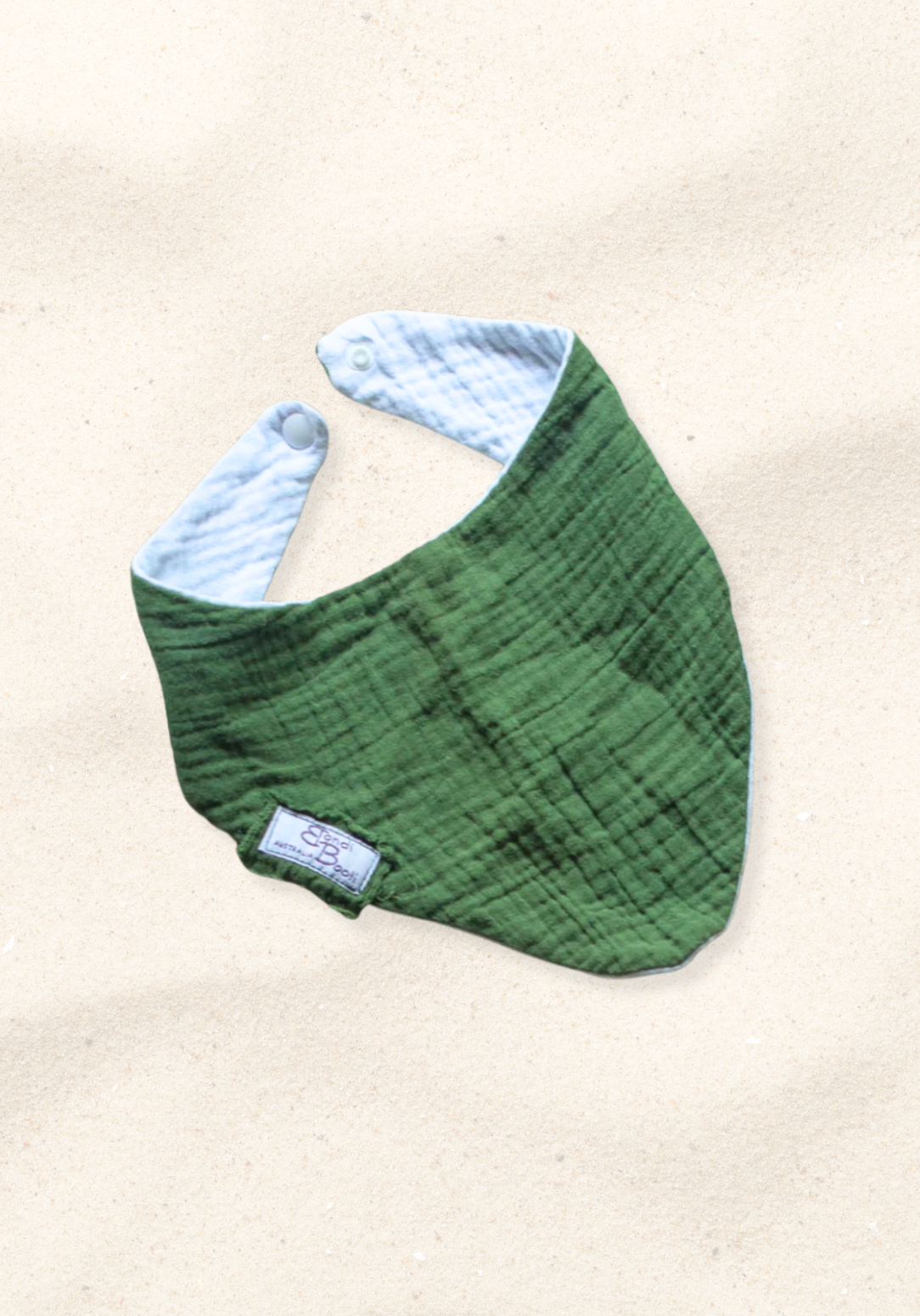 Deep green bandana-style baby bib made from soft organic cotton with absorbent inner lining.