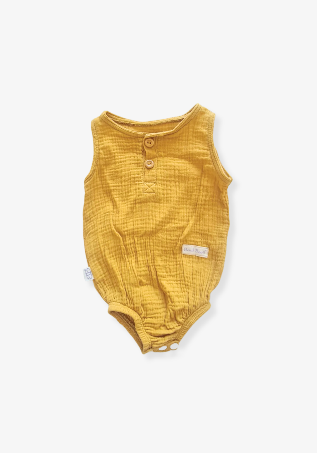 Mustard short sleeve organic cotton baby romper with three snap buttons at the bottom and elasticised leg bands