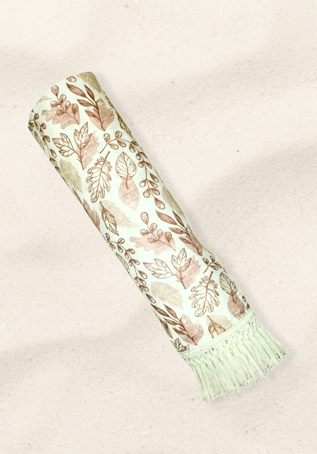 White baby blanket featuring brown and beige leaf patterns with thick fringe trim. Soft cotton-bamboo blend for year-round comfort.