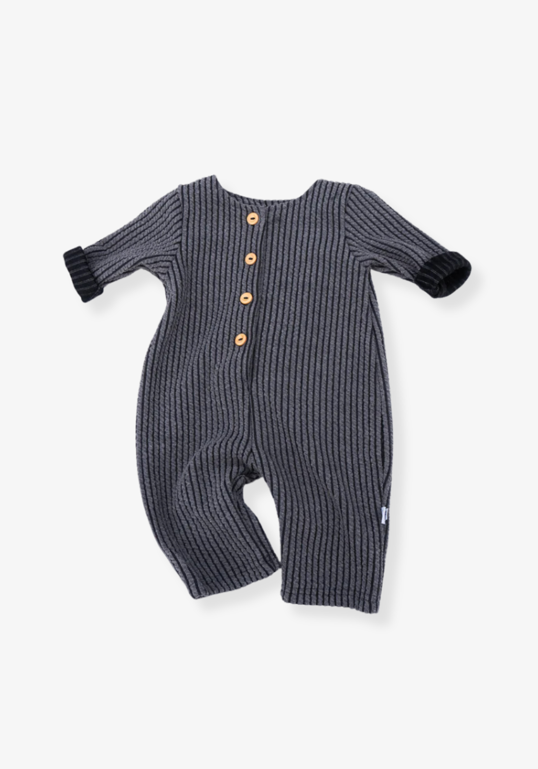 Long oversized baby onesie in charcoal ribbed fabric with front wooden button closure and folded sleeves