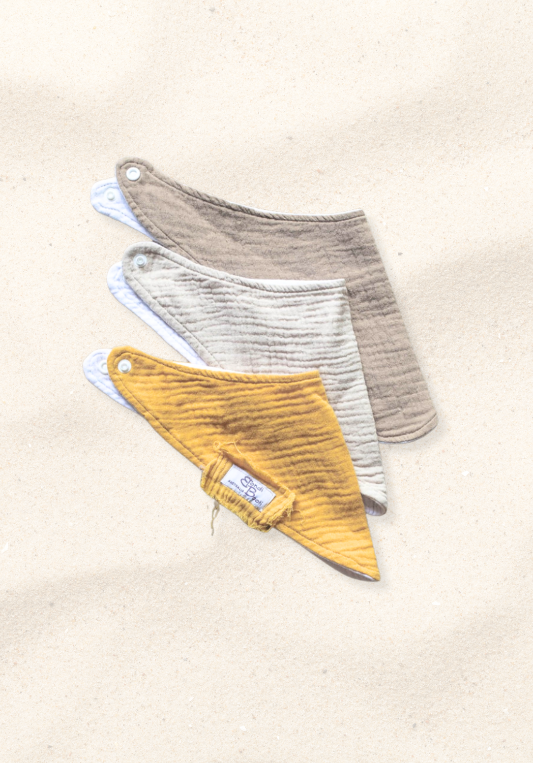 Neutral-toned organic cotton bandana dribble bib gift pack for babies, featuring soft breathable fabric