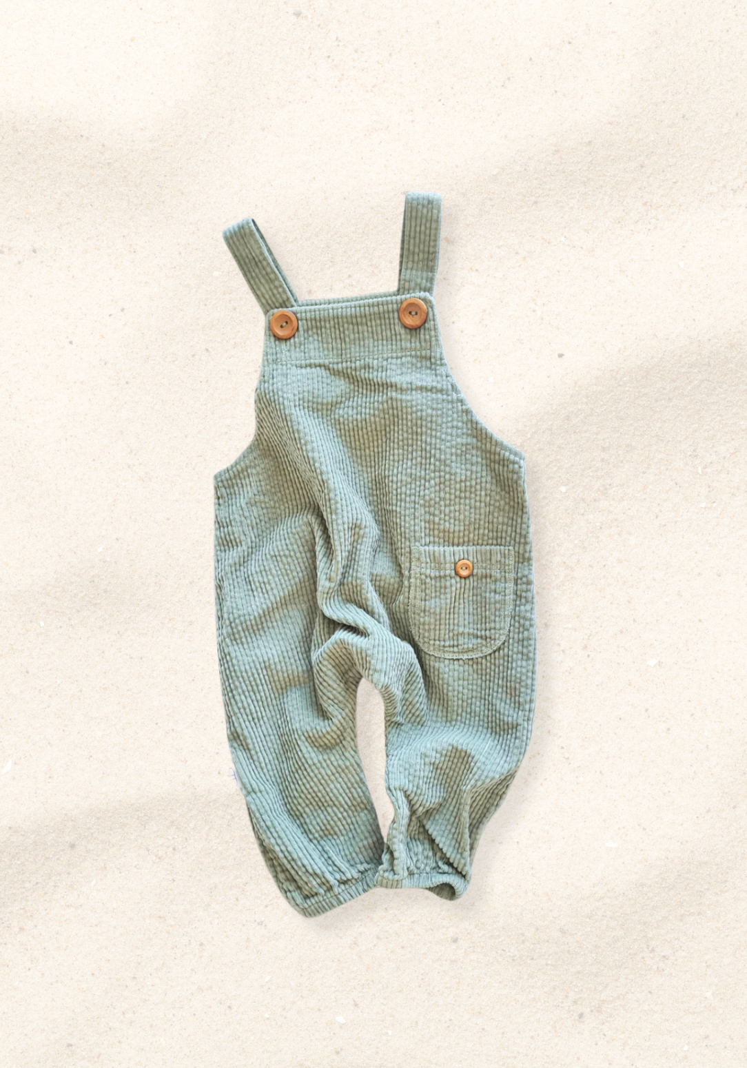 Sage green baby corduroy overall made from soft cotton with front pocket