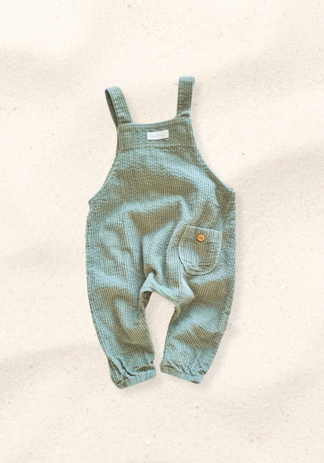 Sage green baby corduroy overall made from soft cotton with front pocket